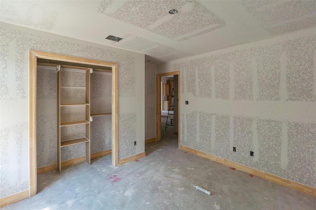 1300 Promised Land Road Hewitt, TX 76643 - Photo 20 of 34 Unfinished interior room featuring a built-in closet with shelving, wood-finish door frames, wood-finish trim, and recessed lighting