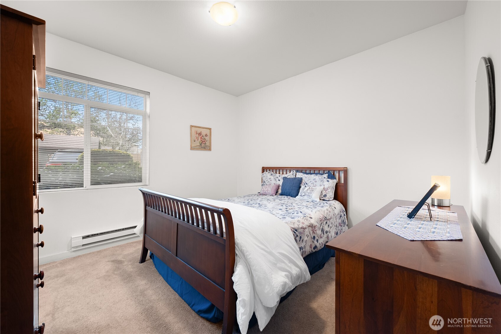 18930 Bothell Everett Highway, Unit G103 Bothell, WA 98012 - Photo 12 of 25 a bedroom with a bed and a window