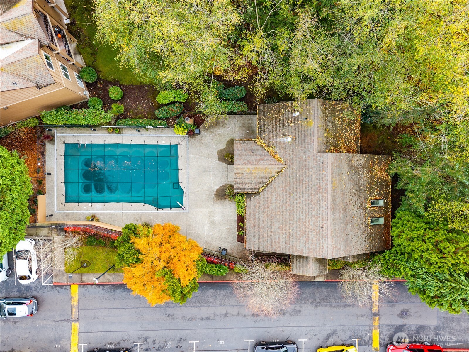 18930 Bothell Everett Highway, Unit G103 Bothell, WA 98012 - Photo 20 of 25 an aerial view of a house with yard and swimming pool