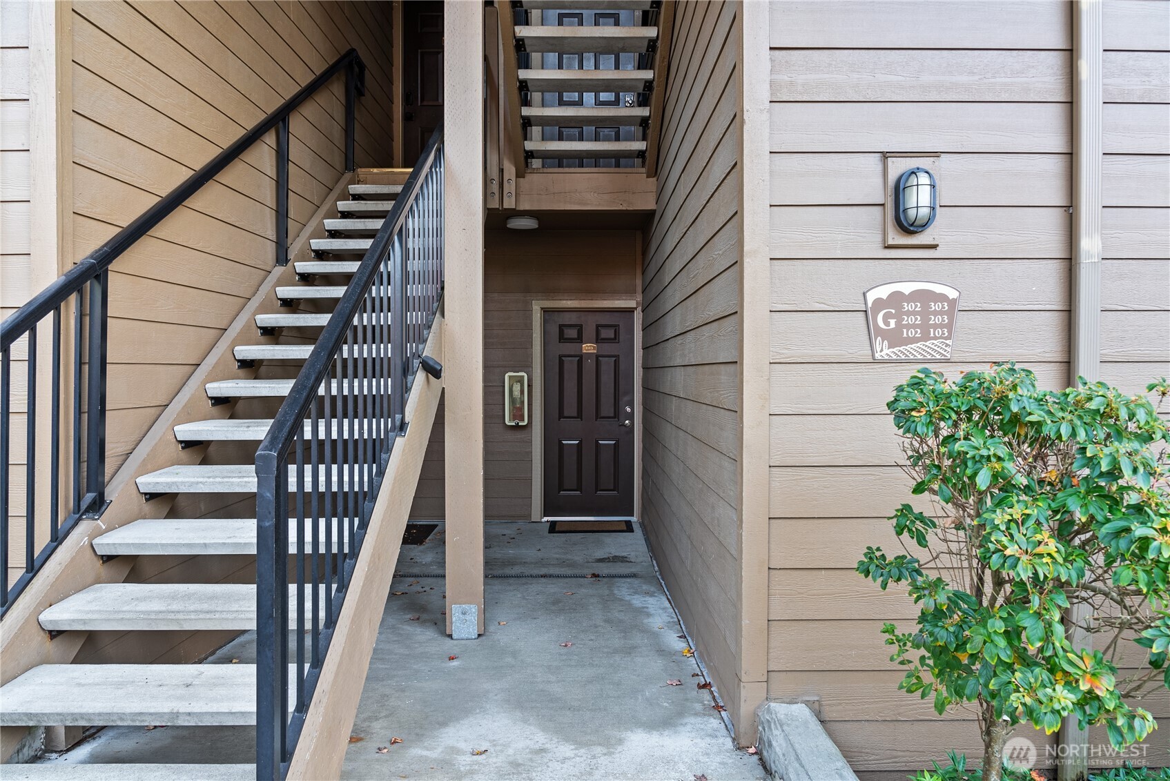 18930 Bothell Everett Highway, Unit G103 Bothell, WA 98012 - Photo 2 of 25 a view of entryway with wooden floor and stairs