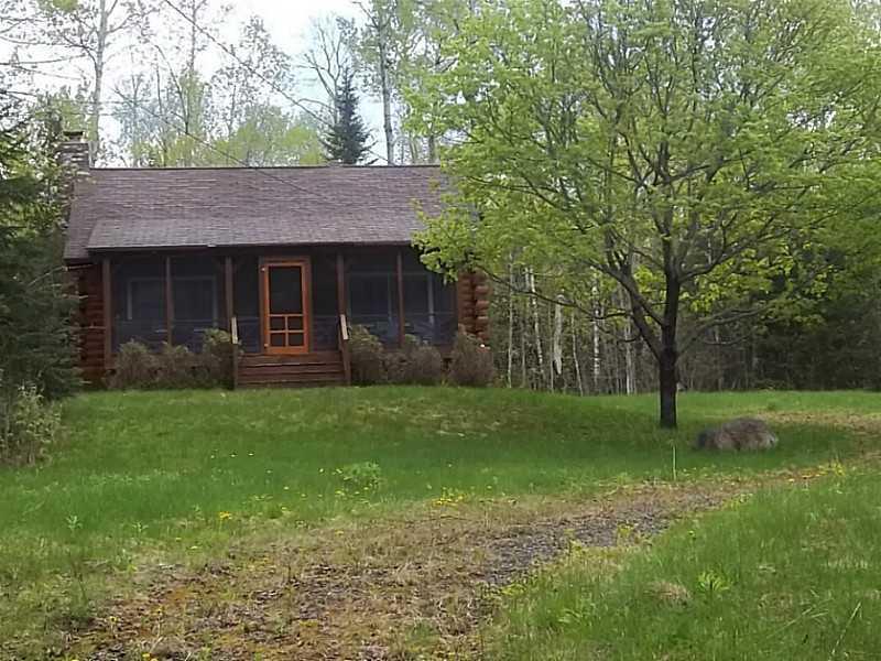 176 Stephens Road Oquossoc, ME 04964 - Photo 2 of 30 Exterior Front. Set back 200 feet...