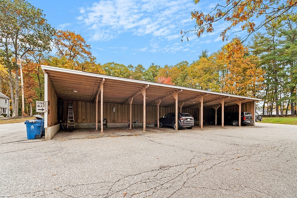 403 Cardinal Lane, Unit 403 Tyngsborough, MA 01879 - Photo 24 of 27 a view of a house with a outdoor space