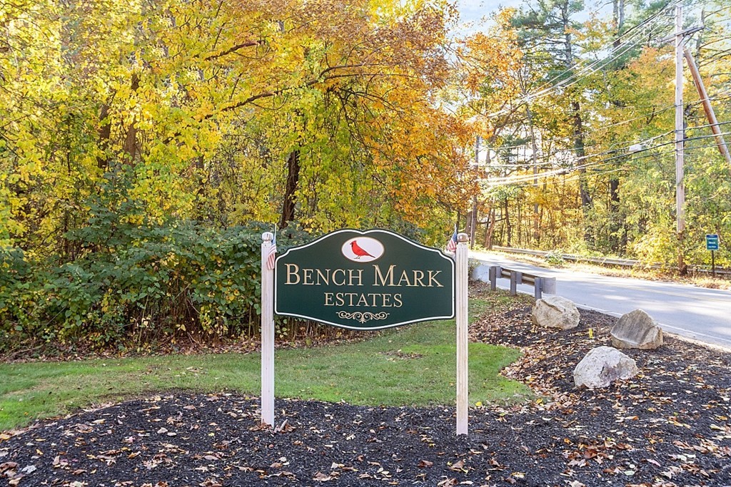 403 Cardinal Lane, Unit 403 Tyngsborough, MA 01879 - Photo 25 of 27 a sign that is sitting in the grass