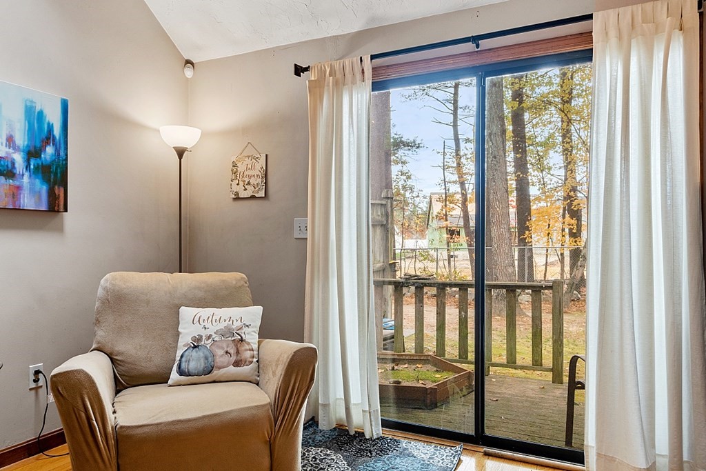 403 Cardinal Lane, Unit 403 Tyngsborough, MA 01879 - Photo 5 of 27 a living room with furniture and a window