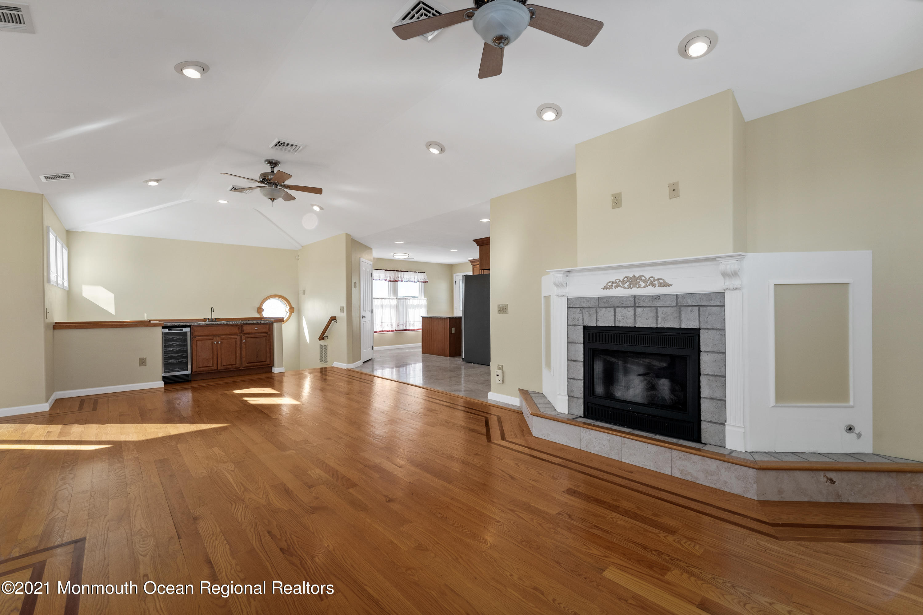303 Heron Road Tuckerton, NJ 08087 - Photo 14 of 58 a view of an empty room with a fireplace and a window