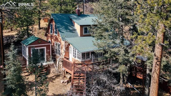 an aerial view of house with yard