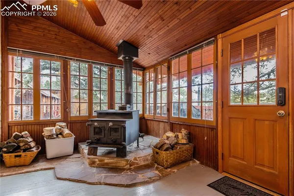 a living room with furniture fireplace and flat screen tv