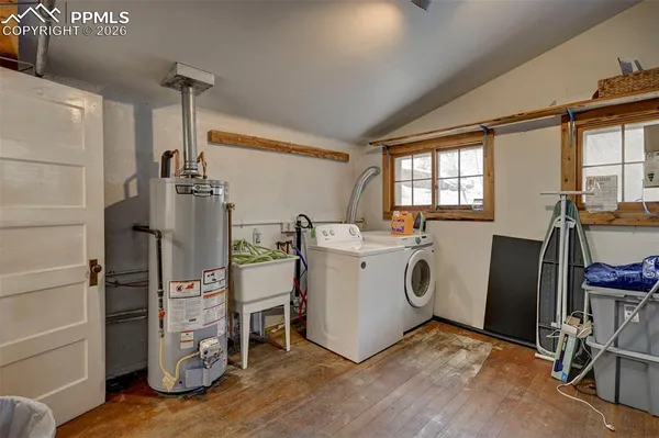 a view of a storage & utility room with closet window