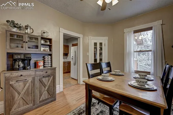a view of a dining room with furniture and wooden floor