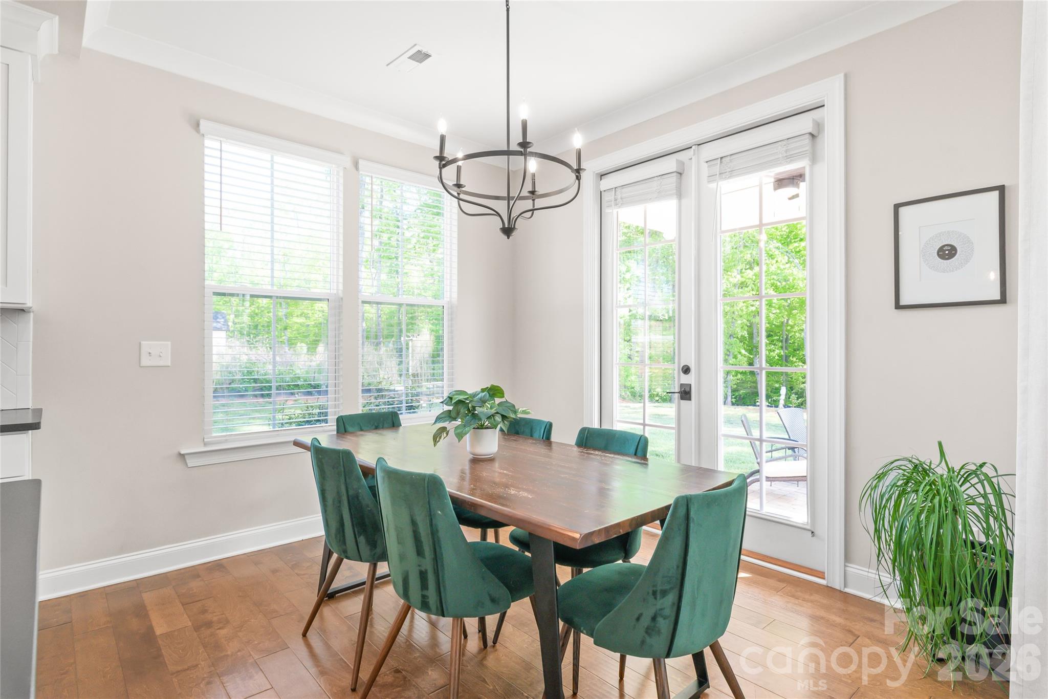 3213 Timber Run Lane Maiden, NC 28650 - Photo 20 of 47 a dining room with furniture a chandelier and wooden floor
