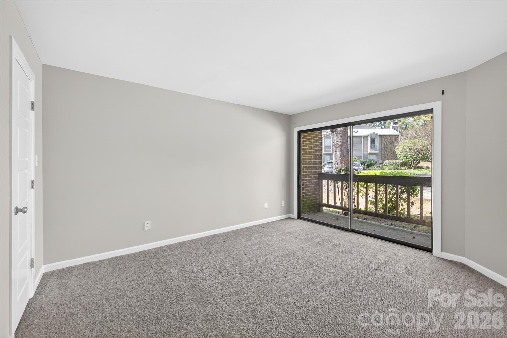 1612 Sharon Road West, Unit 67 Charlotte, NC 28210 - Photo 18 of 19 a view of an empty room with a window