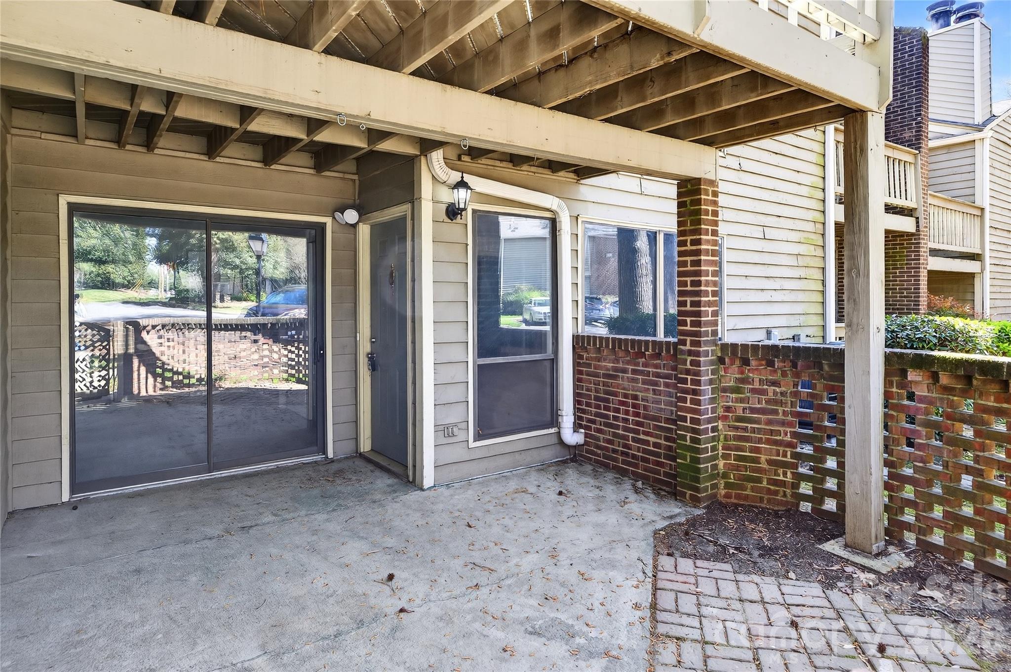 1612 Sharon Road West, Unit 67 Charlotte, NC 28210 - Photo 2 of 19 a view of empty room with windows