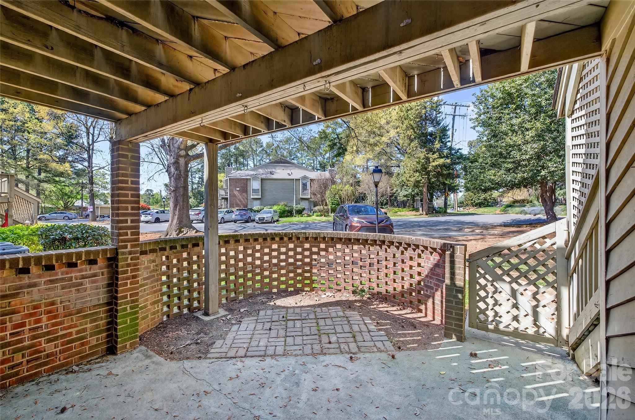1612 Sharon Road West, Unit 67 Charlotte, NC 28210 - Photo 3 of 19 a view of roof deck with wooden fence