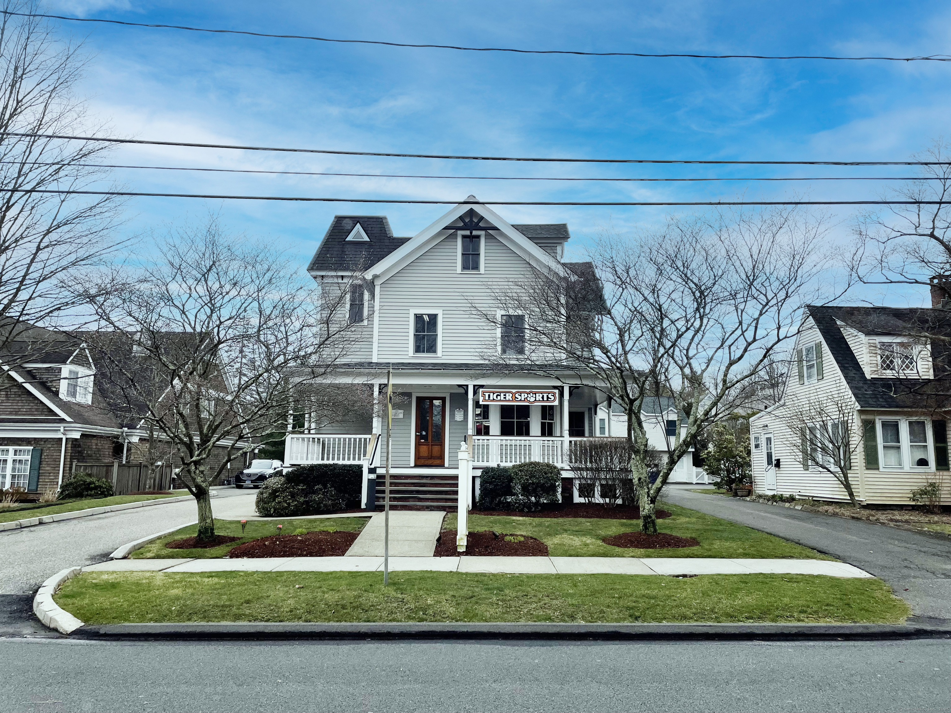 27 Catoonah Street Ridgefield, CT 06877 - Photo 1 of 1 a front view of a house with a yard
