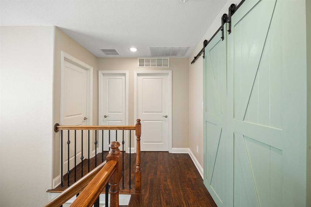 738 East Main Street Coppell, TX 75019 - Photo 14 of 27 a view of a hallway with wooden floor