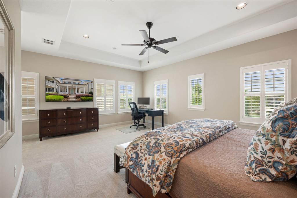 738 East Main Street Coppell, TX 75019 - Photo 22 of 27 a bedroom with a bed and a dresser