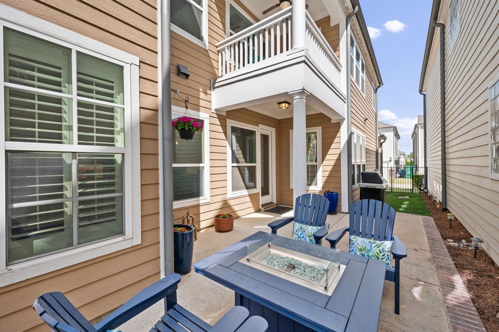 738 East Main Street Coppell, TX 75019 - Photo 25 of 27 a view of a patio with couches table and chairs and potted plants