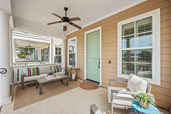 a living room with furniture and windows
