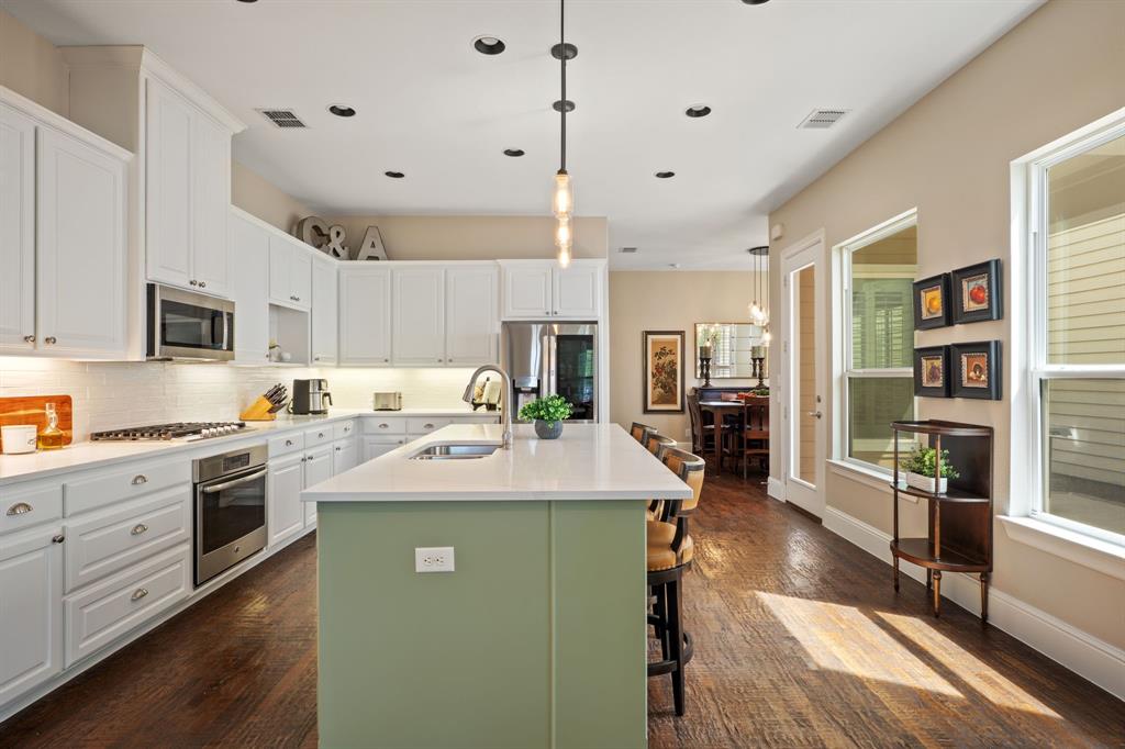 738 East Main Street Coppell, TX 75019 - Photo 7 of 27 a kitchen with stainless steel appliances granite countertop a sink stove and cabinets