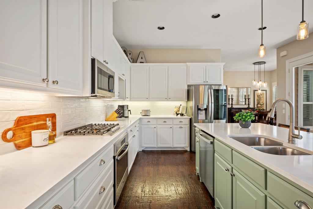 738 East Main Street Coppell, TX 75019 - Photo 8 of 27 a kitchen with a sink stove and refrigerator