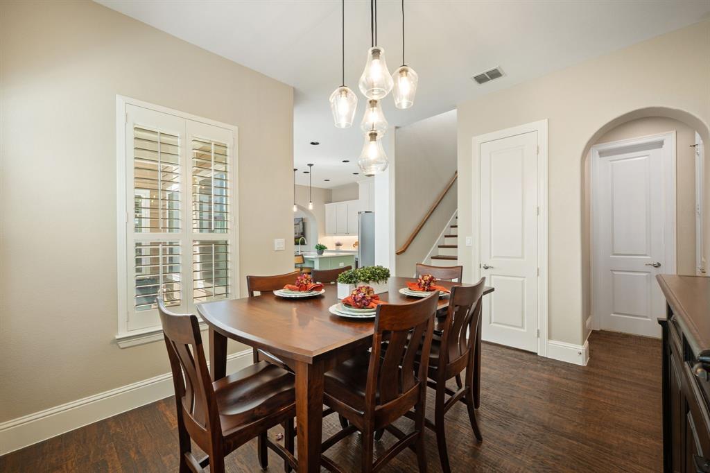 738 East Main Street Coppell, TX 75019 - Photo 10 of 27 a view of a dining room with furniture window and wooden floor