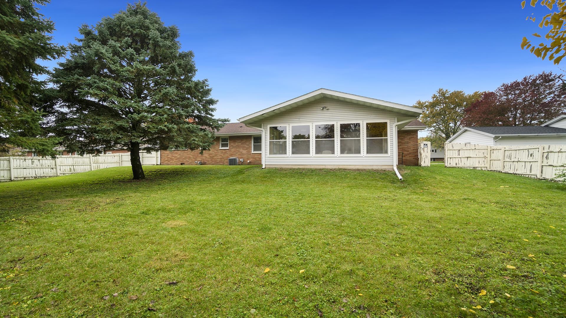 1405 Crest Lane Rochelle, IL 61068 - Photo 28 of 30 a front view of a house with a yard