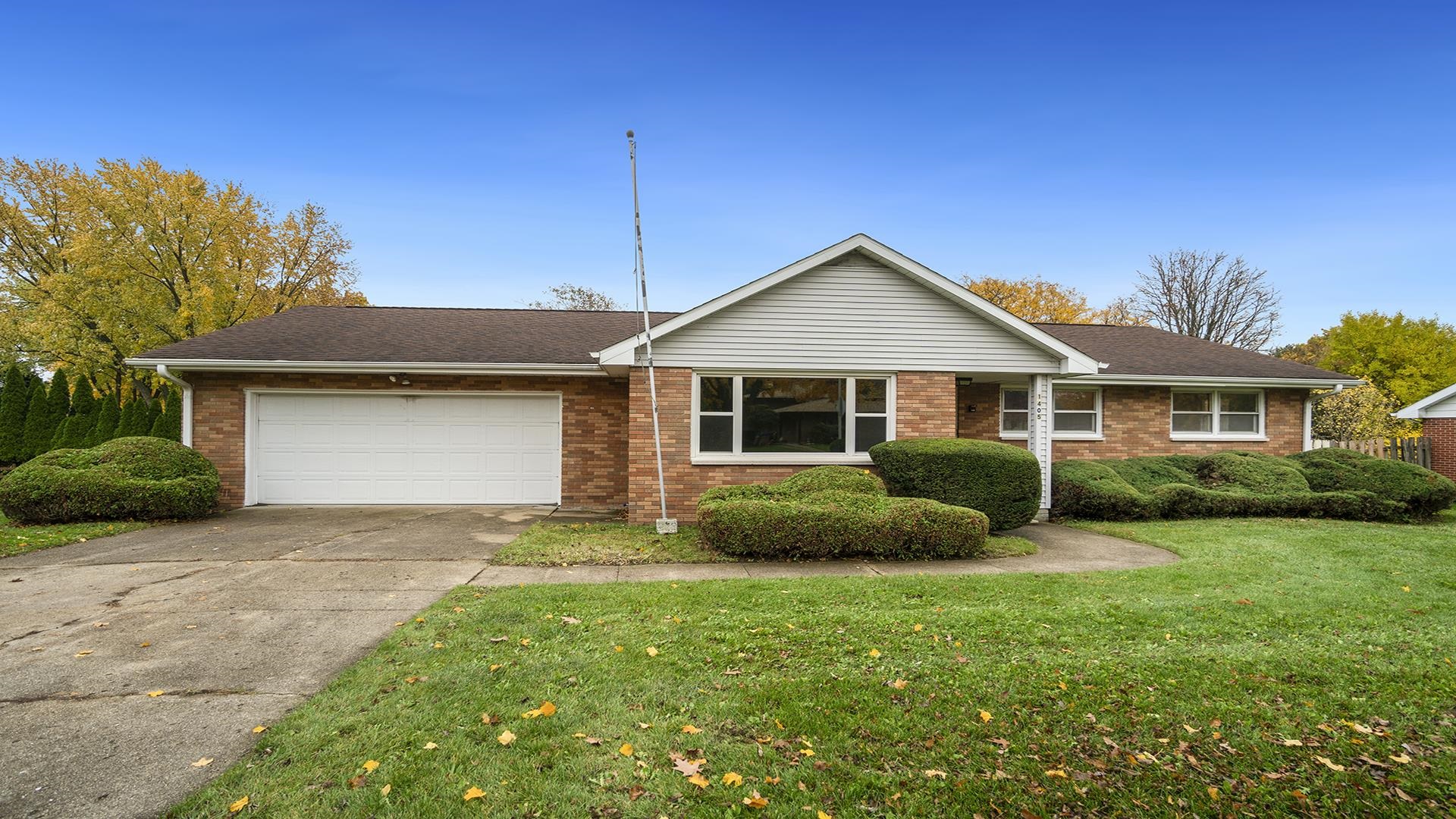 1405 Crest Lane Rochelle, IL 61068 - Photo 30 of 30 a front view of a house with a yard and garage