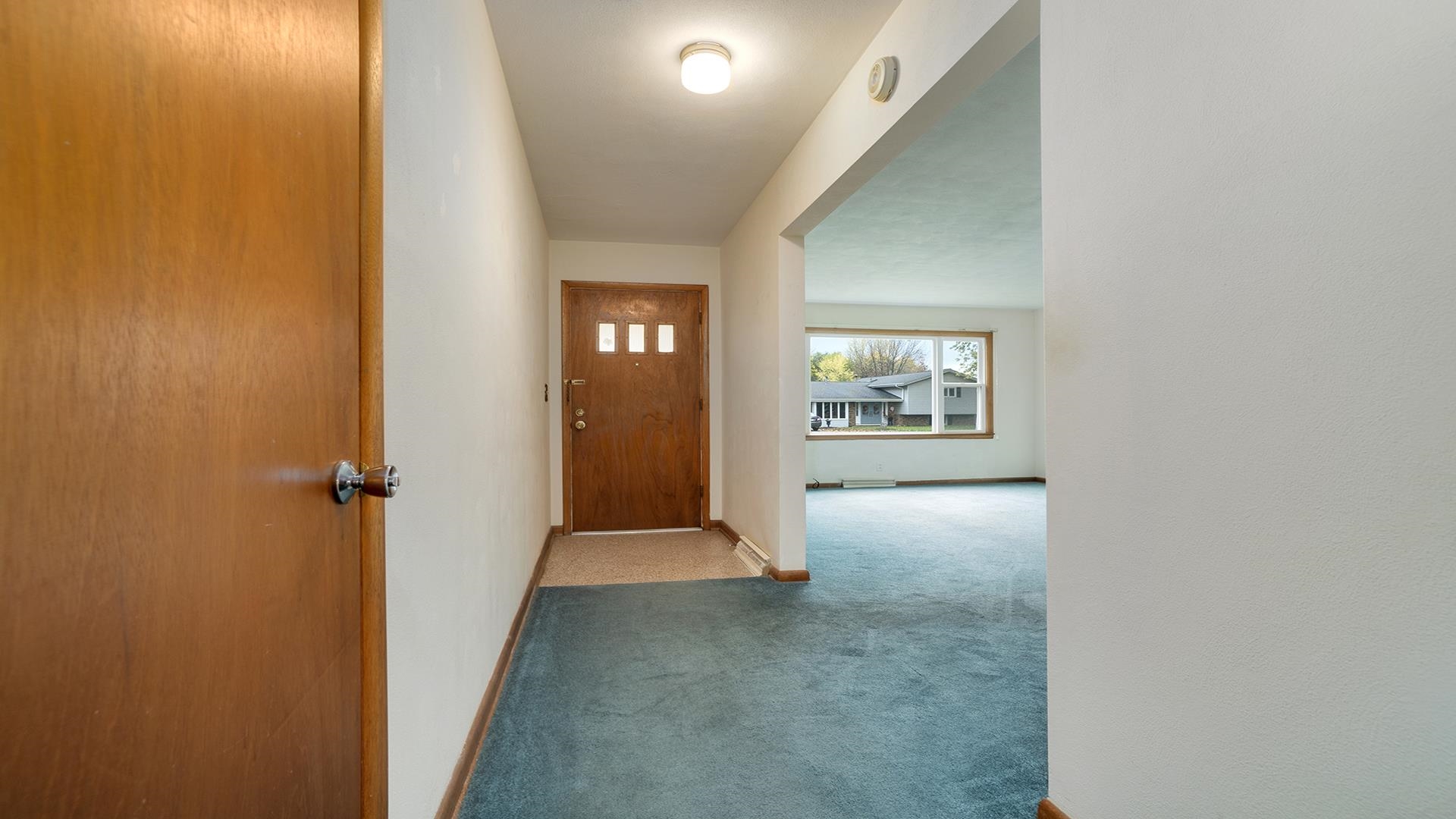 1405 Crest Lane Rochelle, IL 61068 - Photo 4 of 30 wooden floor in a hall with a window