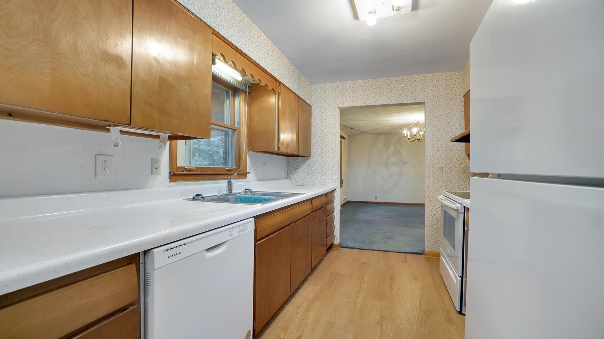 1405 Crest Lane Rochelle, IL 61068 - Photo 10 of 30 a kitchen with a sink stove and cabinets