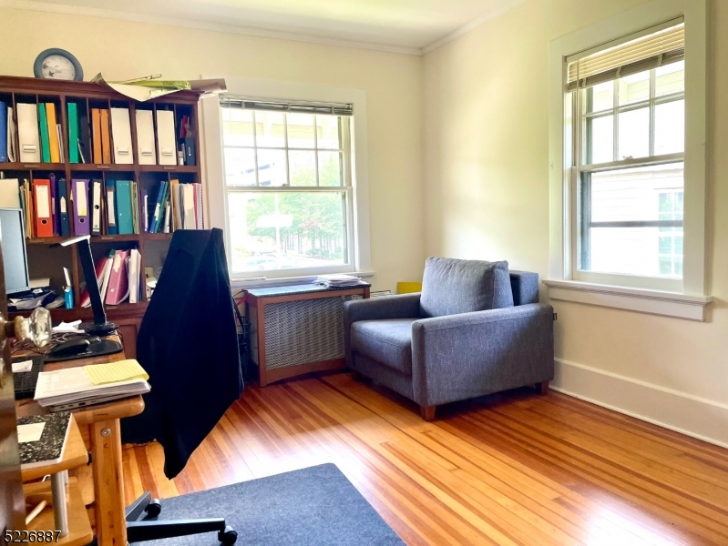 19 Valley Road Montclair, NJ 07042 - Photo 16 of 22 a living room with furniture fireplace and a window