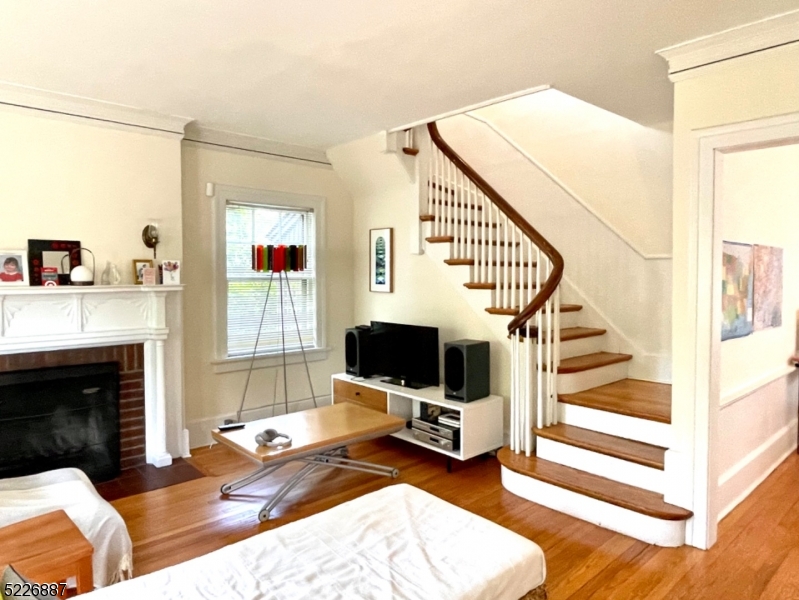 19 Valley Road Montclair, NJ 07042 - Photo 18 of 22 a living room with furniture and a fireplace