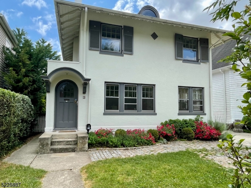 19 Valley Road Montclair, NJ 07042 - Photo 2 of 22 a front view of a house with garden