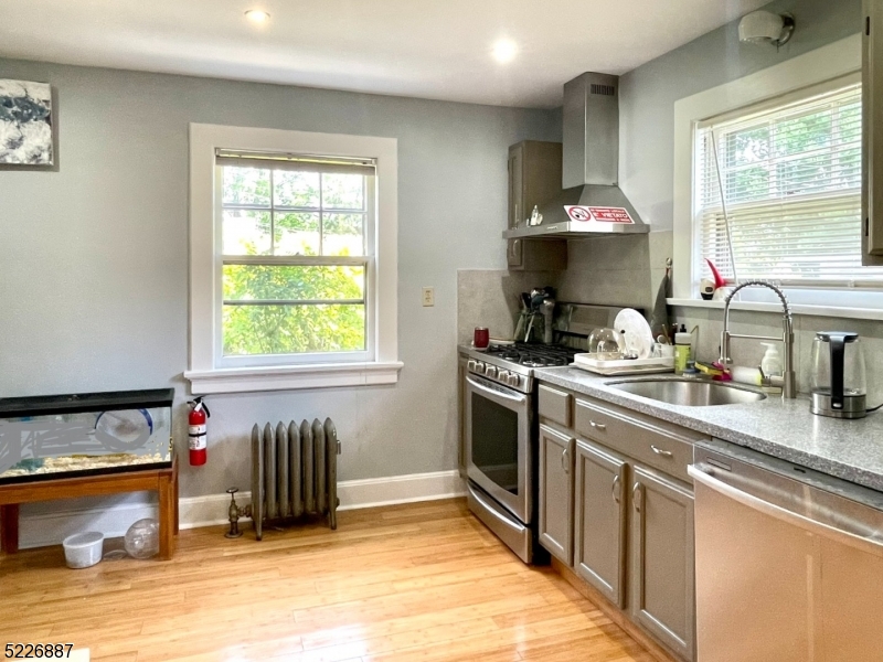 19 Valley Road Montclair, NJ 07042 - Photo 7 of 22 a kitchen with a sink stove and cabinets