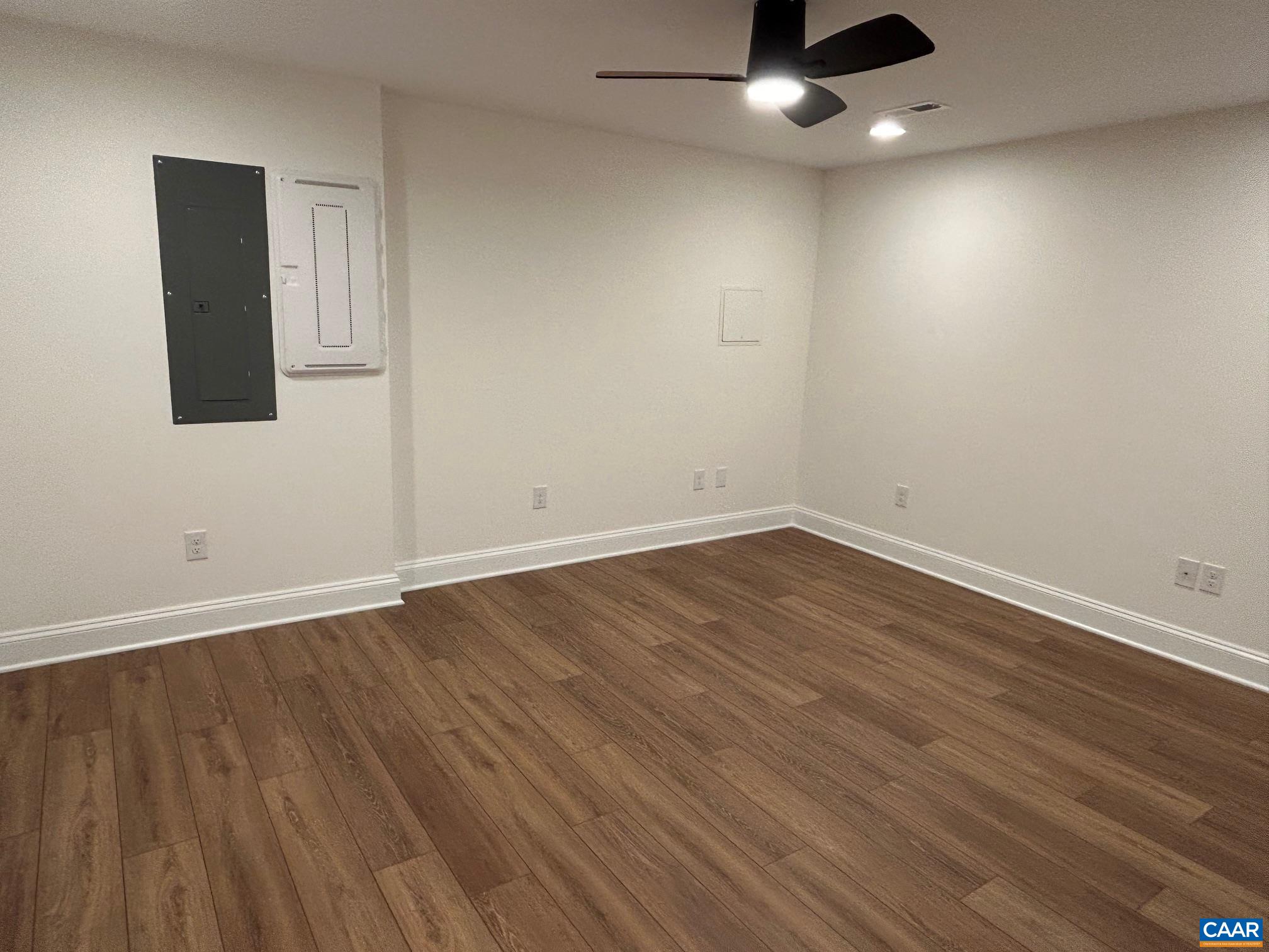329 Carrsbrook Drive Charlottesville, VA 22901 - Photo 32 of 75 an empty room with wooden floor and windows