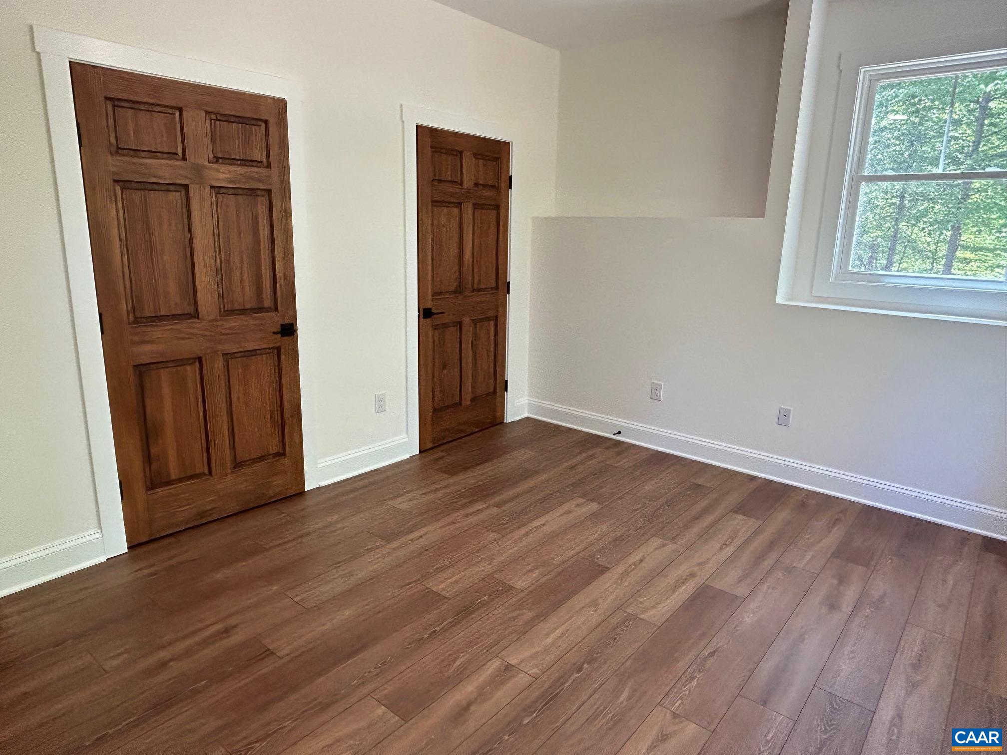 329 Carrsbrook Drive Charlottesville, VA 22901 - Photo 33 of 75 an empty room with wooden floor and closet area