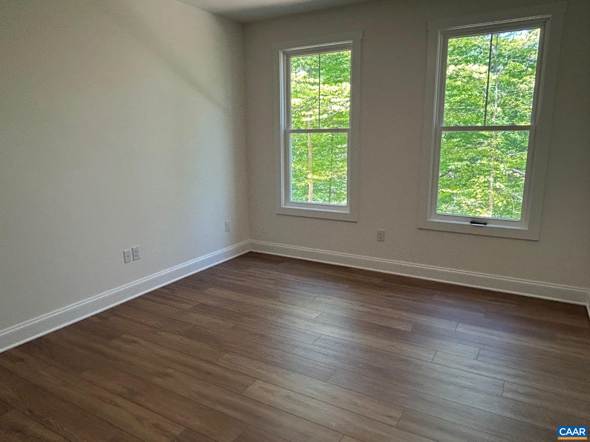 329 Carrsbrook Drive Charlottesville, VA 22901 - Photo 38 of 75 an empty room with wooden floor and windows