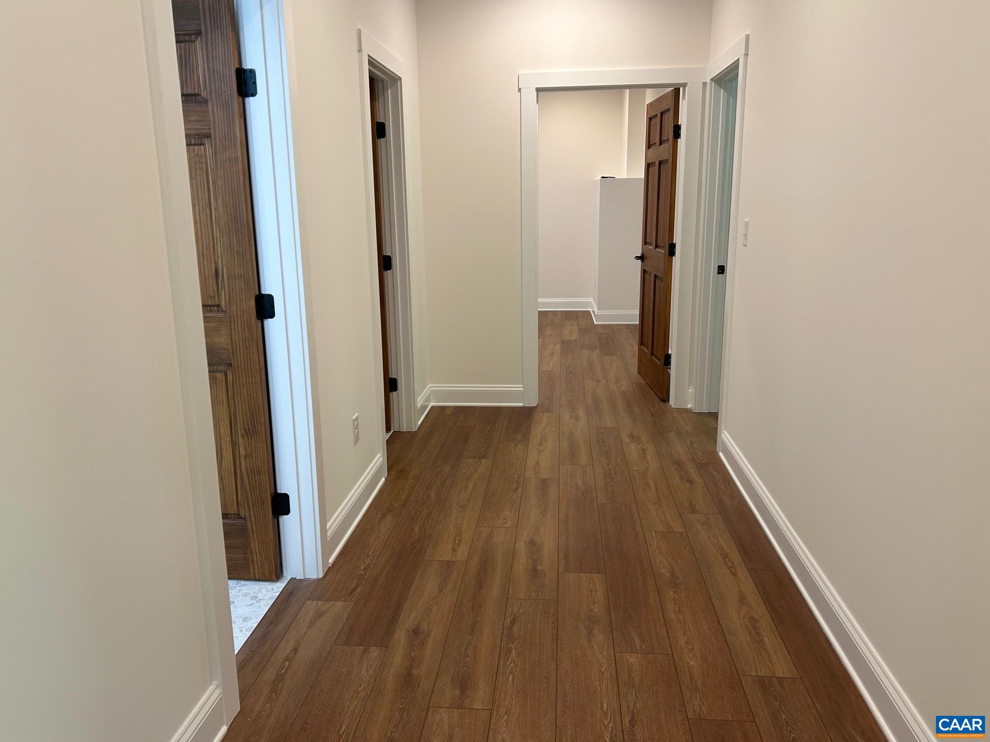 329 Carrsbrook Drive Charlottesville, VA 22901 - Photo 39 of 75 a view of a hallway with wooden floor