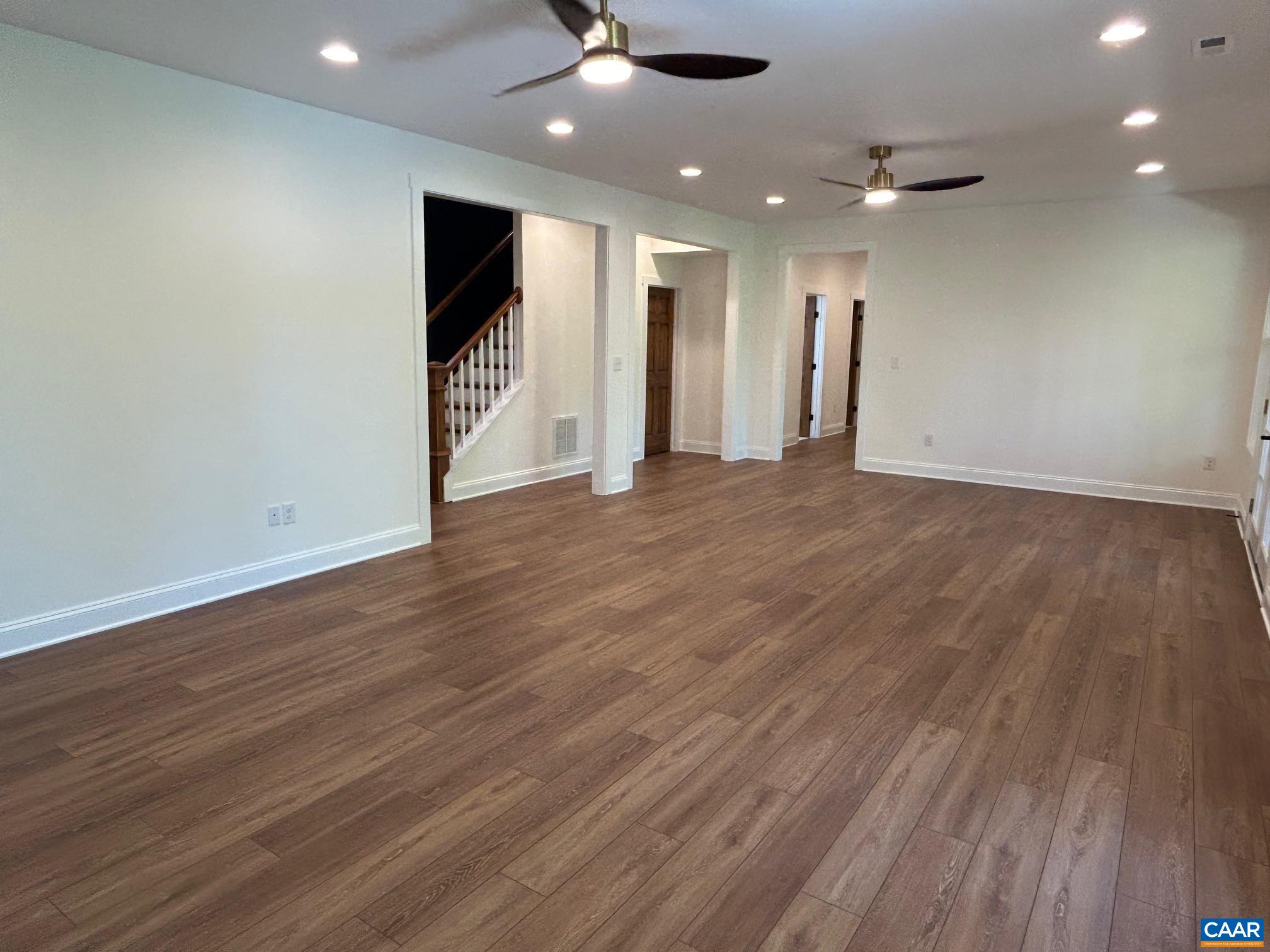 329 Carrsbrook Drive Charlottesville, VA 22901 - Photo 40 of 75 an empty room with wooden floor and a ceiling fan
