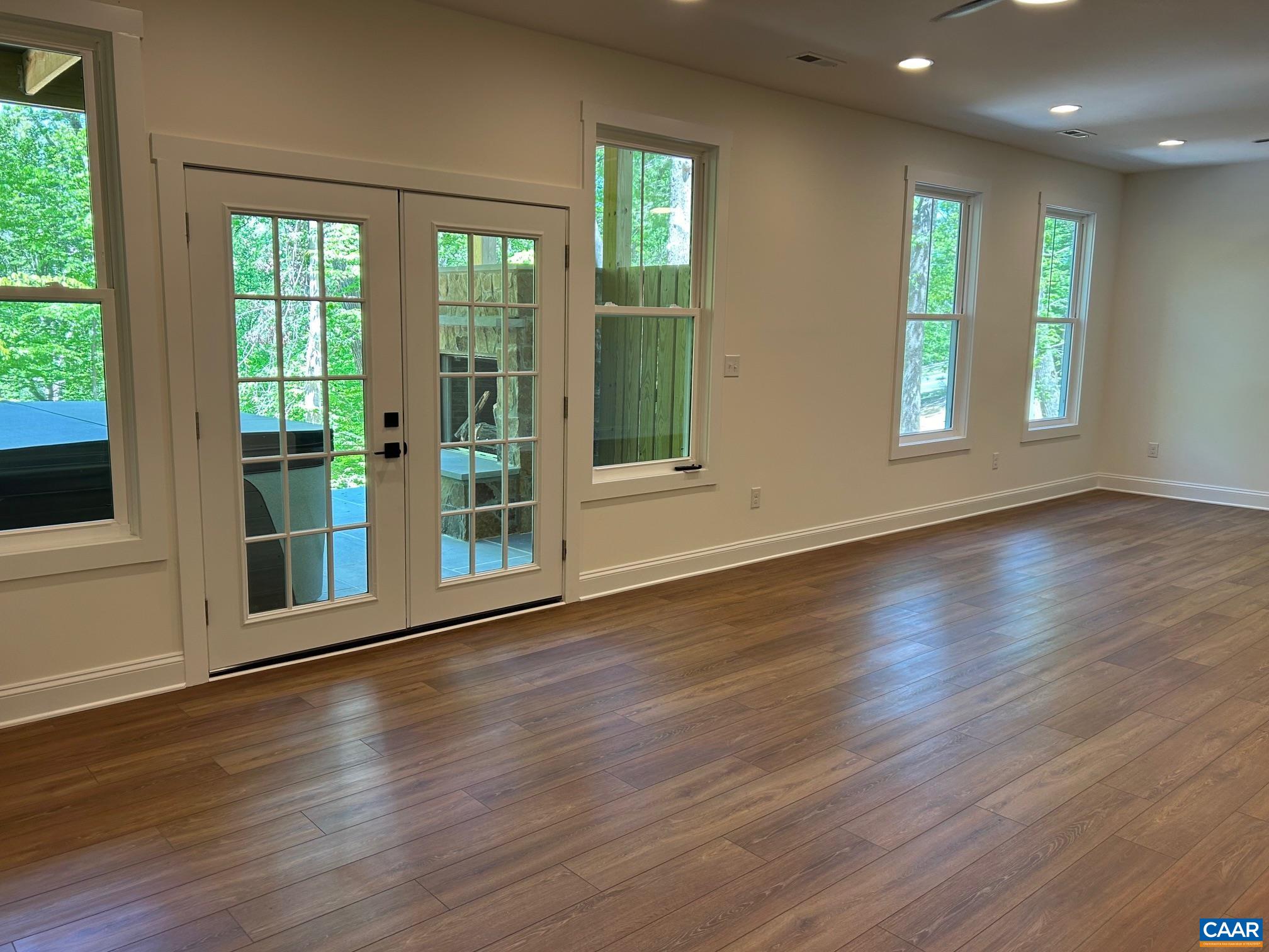 329 Carrsbrook Drive Charlottesville, VA 22901 - Photo 42 of 75 an empty room with wooden floor and windows
