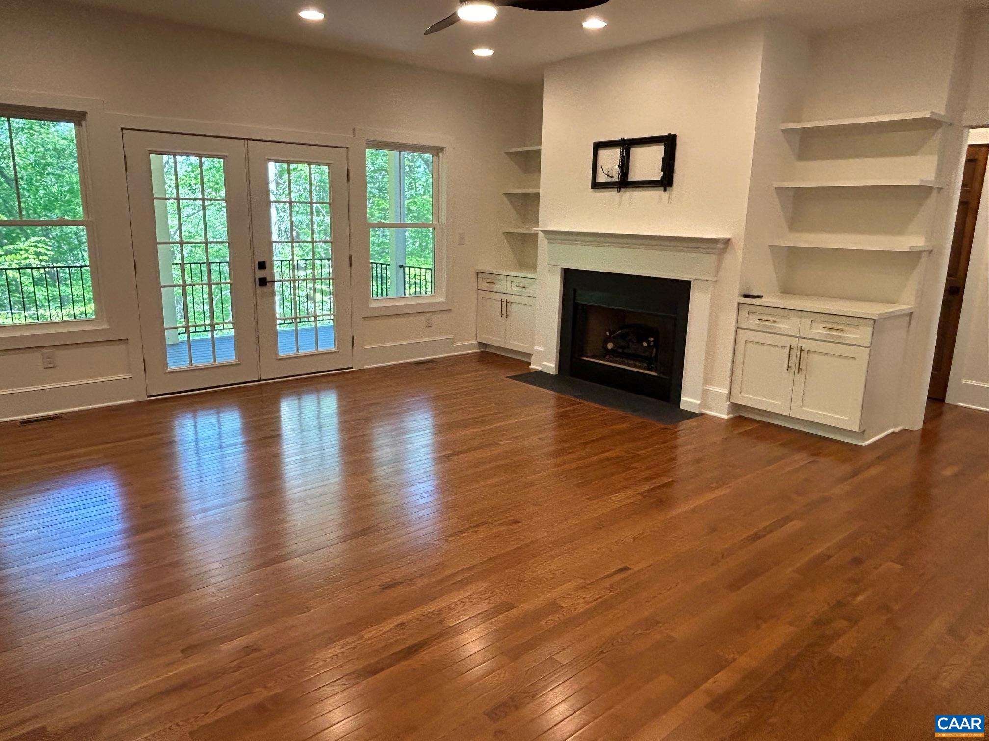 329 Carrsbrook Drive Charlottesville, VA 22901 - Photo 45 of 75 a view of a livingroom with wooden floor a fireplace and window