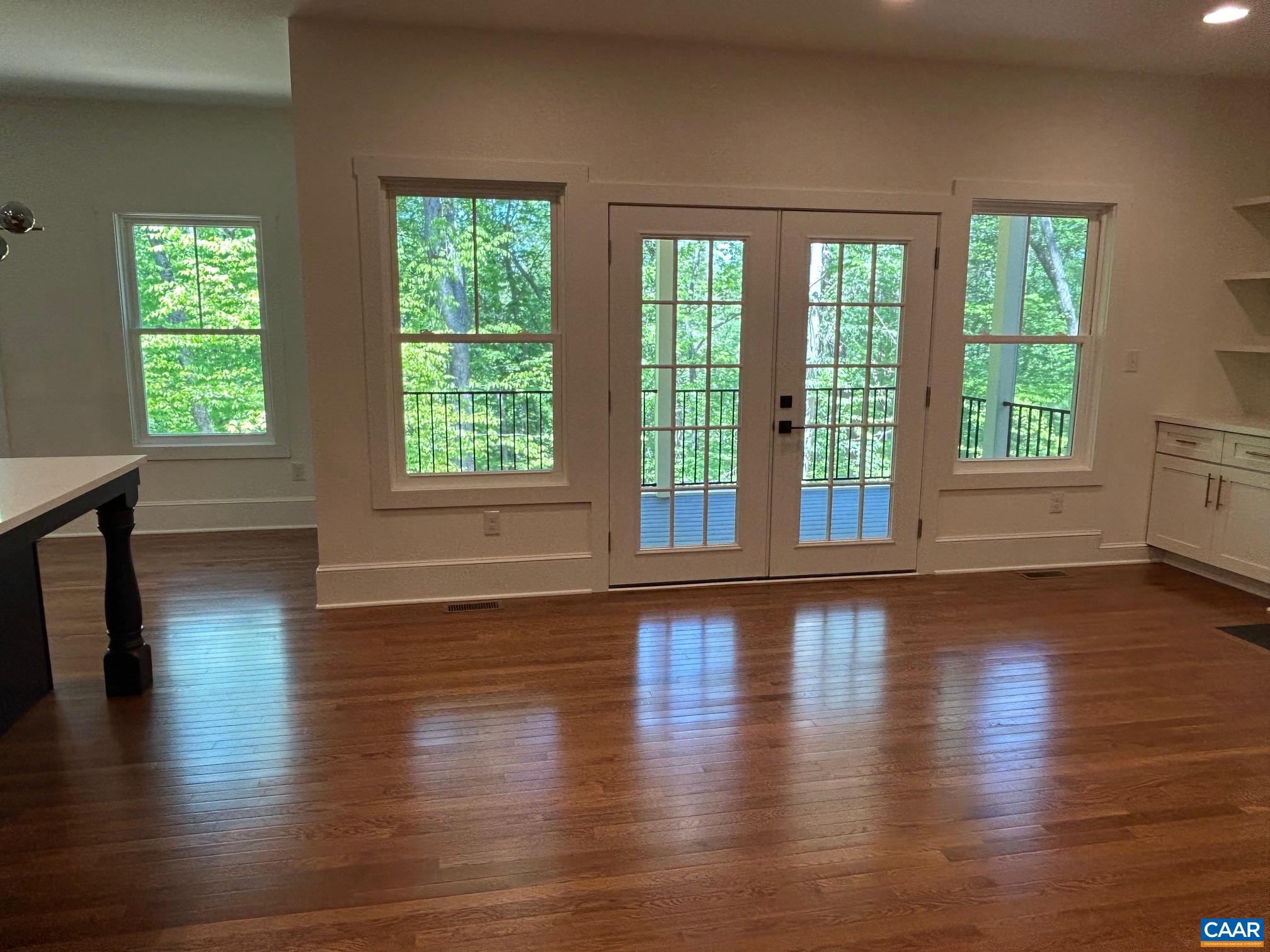 329 Carrsbrook Drive Charlottesville, VA 22901 - Photo 46 of 75 a view of an empty room with wooden floor and a window