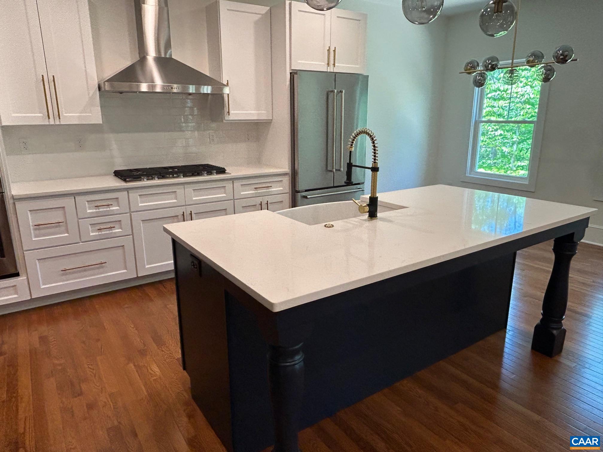 329 Carrsbrook Drive Charlottesville, VA 22901 - Photo 48 of 75 a kitchen with a sink a stove and wooden floor
