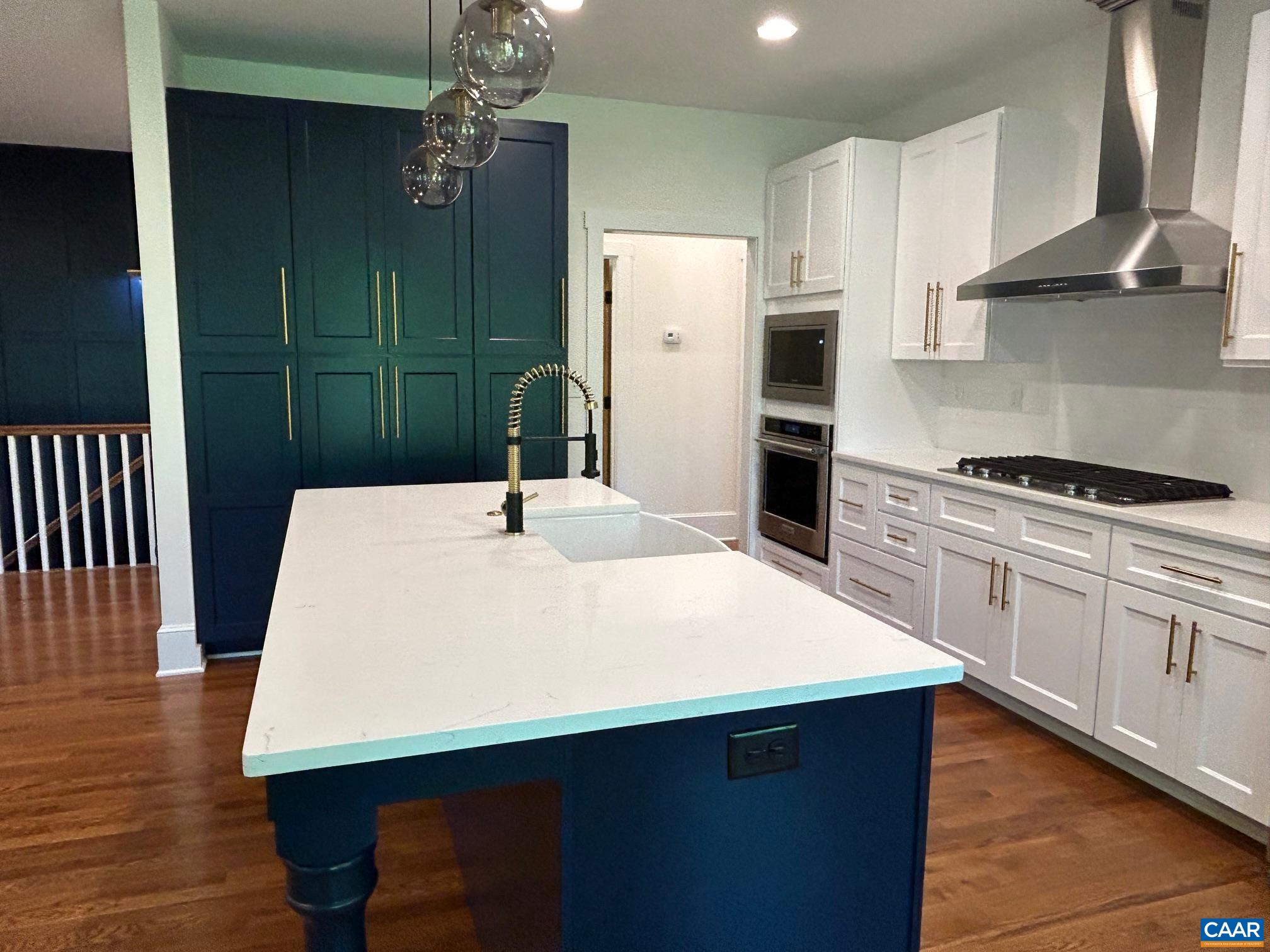 329 Carrsbrook Drive Charlottesville, VA 22901 - Photo 50 of 75 a kitchen with kitchen island wooden cabinets a counter top space and appliances