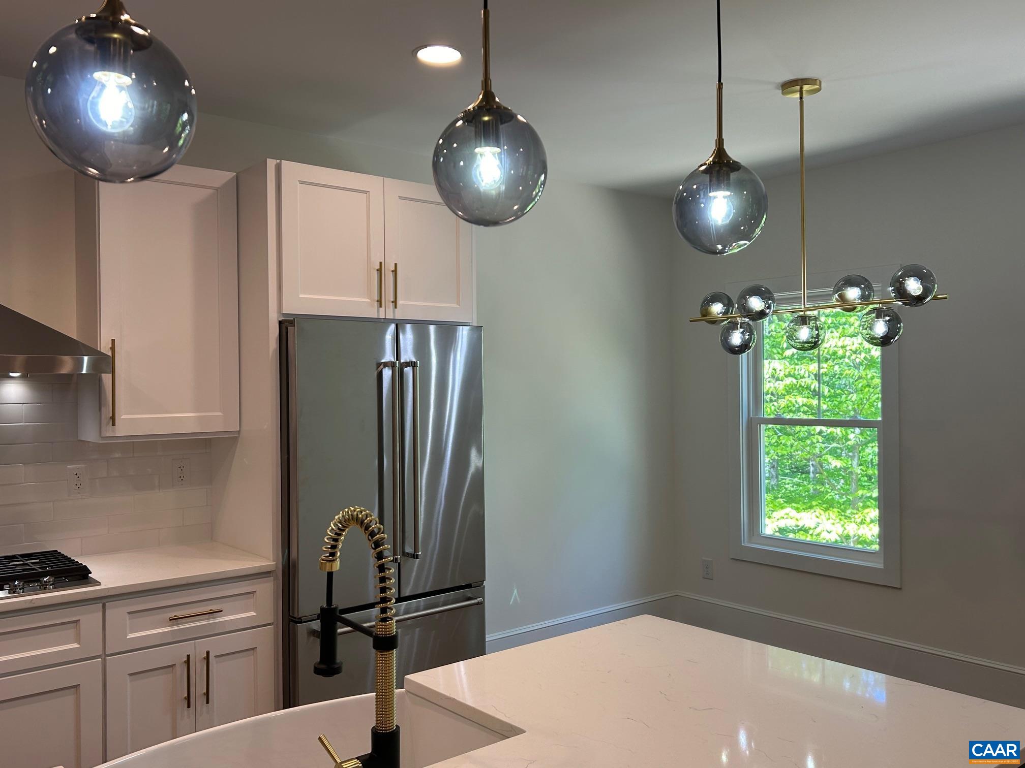329 Carrsbrook Drive Charlottesville, VA 22901 - Photo 54 of 75 a view of a kitchen with a sink and chandelier