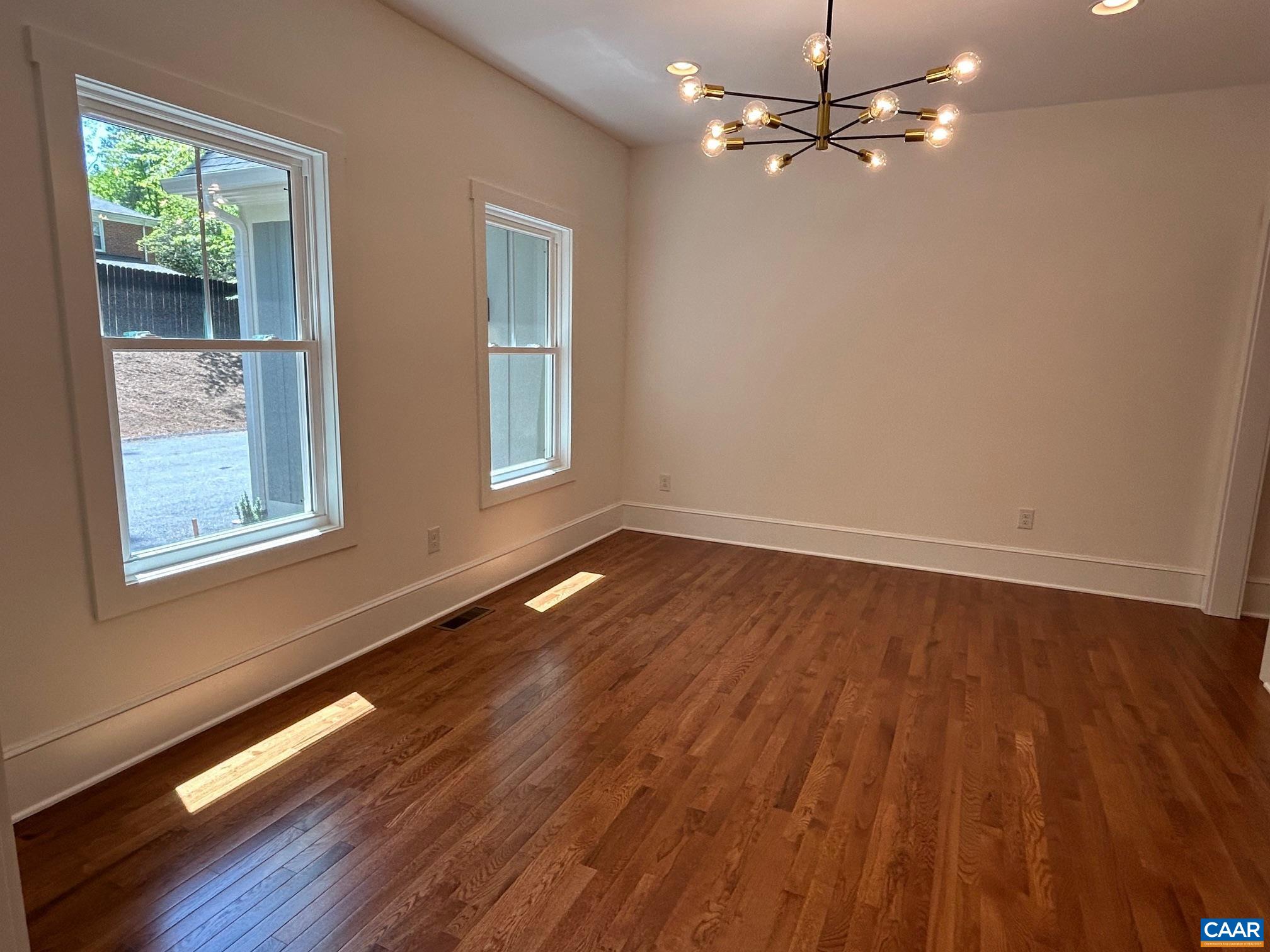 329 Carrsbrook Drive Charlottesville, VA 22901 - Photo 56 of 75 a view of empty room with wooden floor and fan