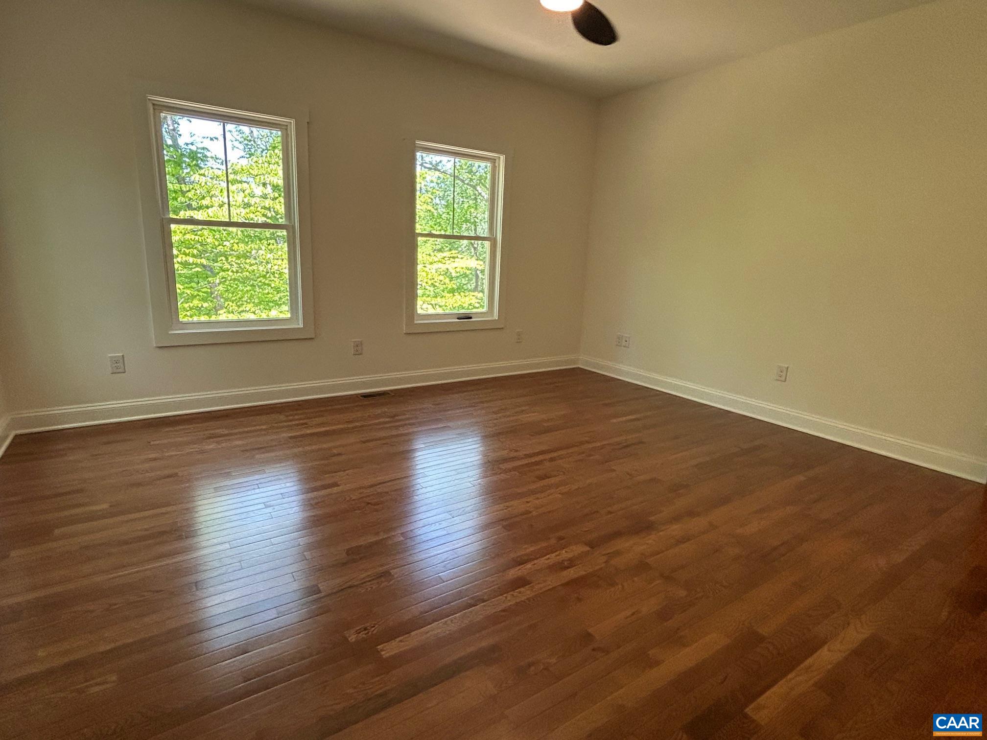 329 Carrsbrook Drive Charlottesville, VA 22901 - Photo 57 of 75 an empty room with wooden floor and windows