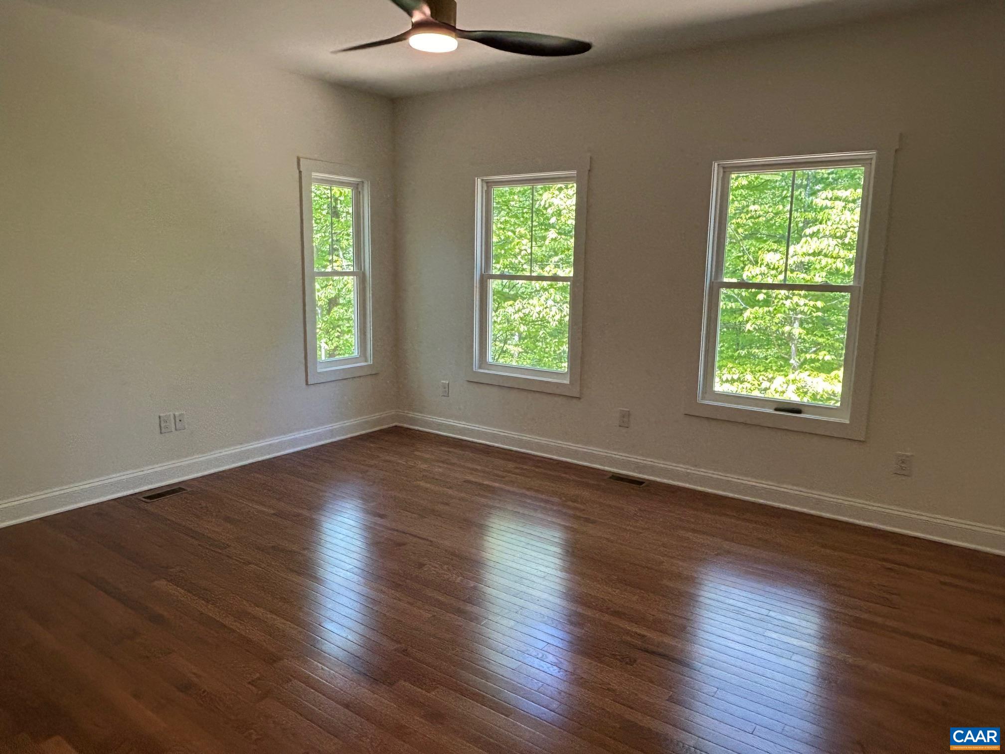 329 Carrsbrook Drive Charlottesville, VA 22901 - Photo 58 of 75 a view of an empty room with wooden floor and a window