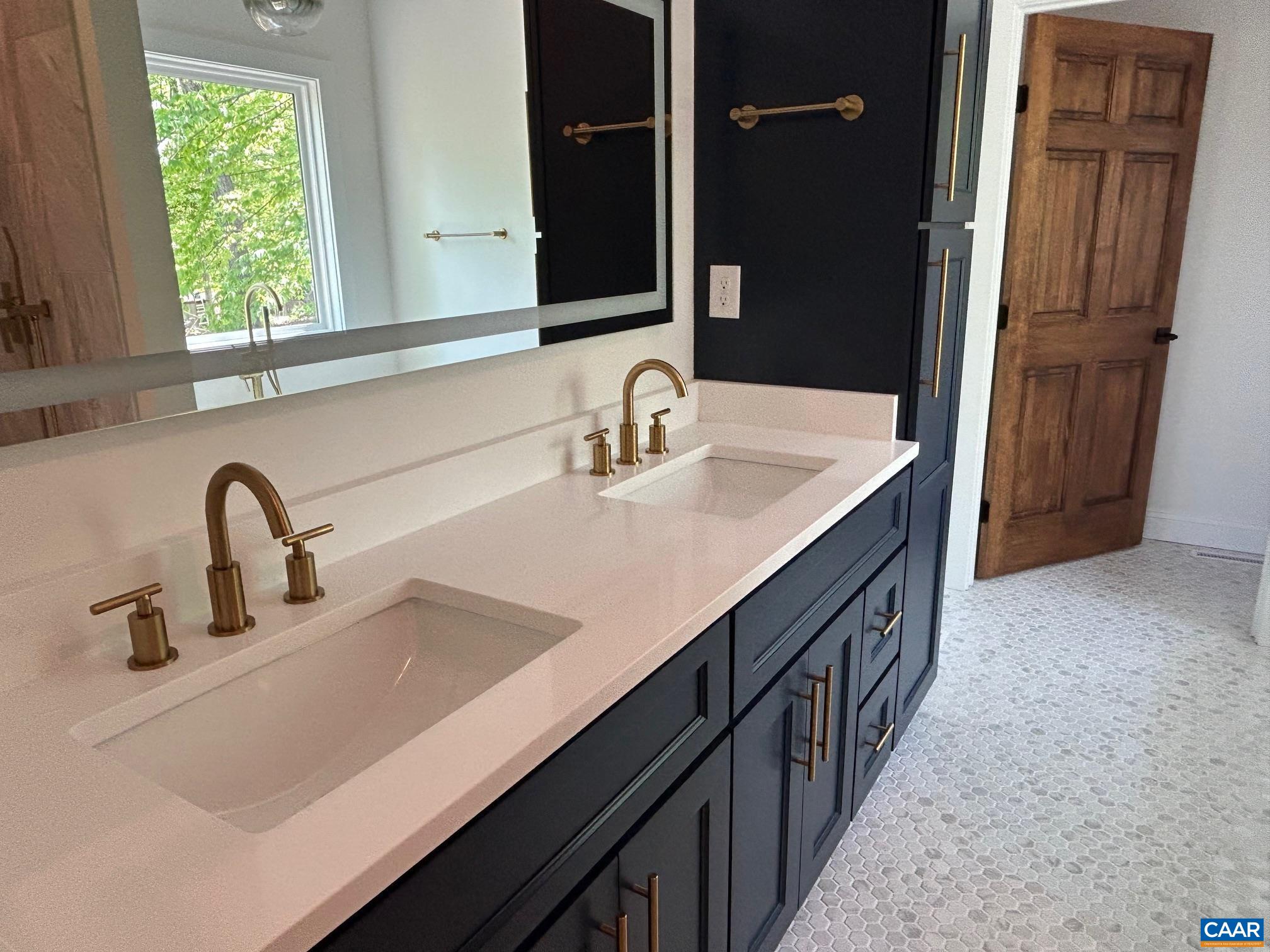 329 Carrsbrook Drive Charlottesville, VA 22901 - Photo 61 of 75 a bathroom with a sink and a mirror