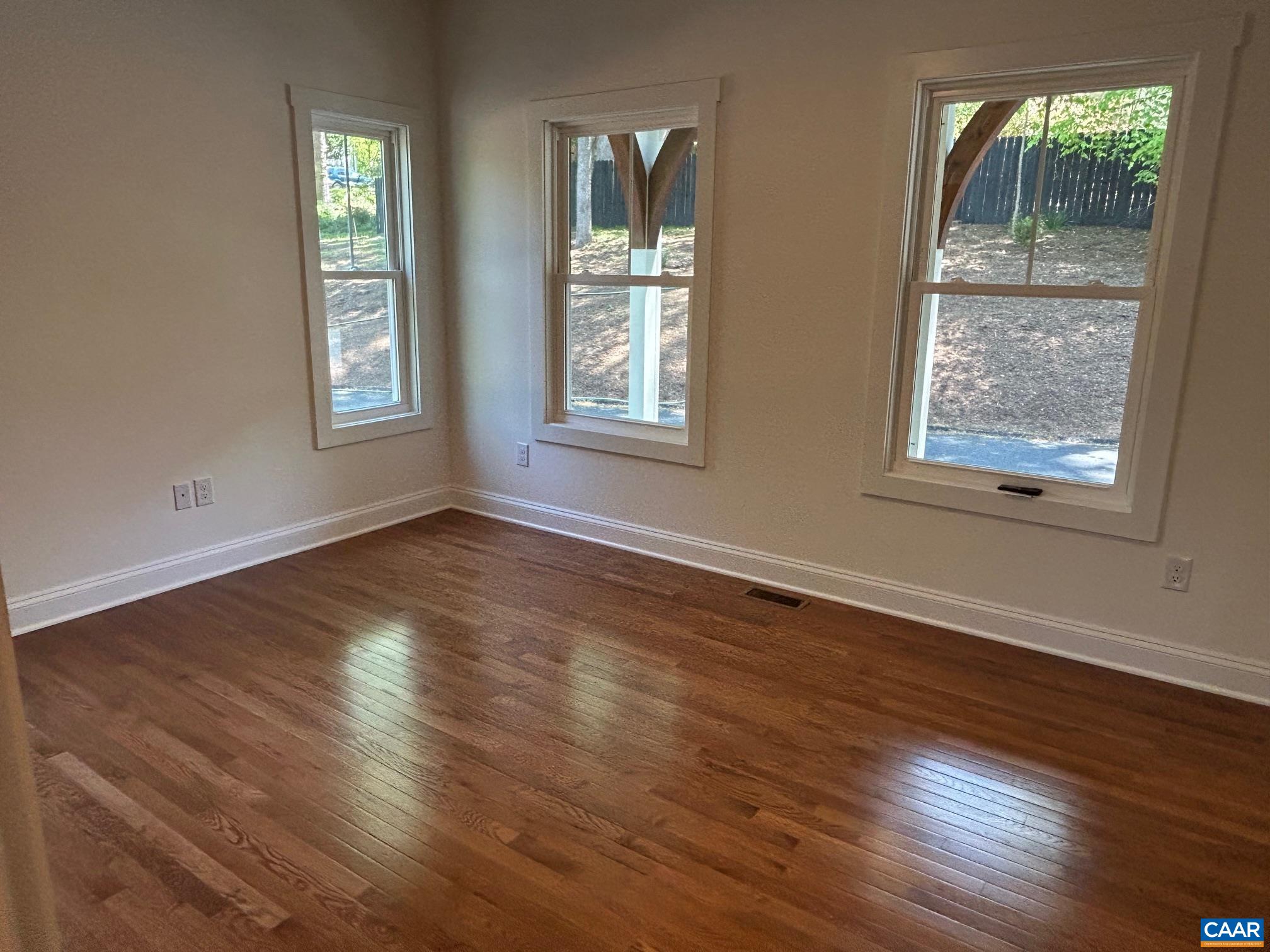 329 Carrsbrook Drive Charlottesville, VA 22901 - Photo 71 of 75 a view of an empty room with wooden floor and a window