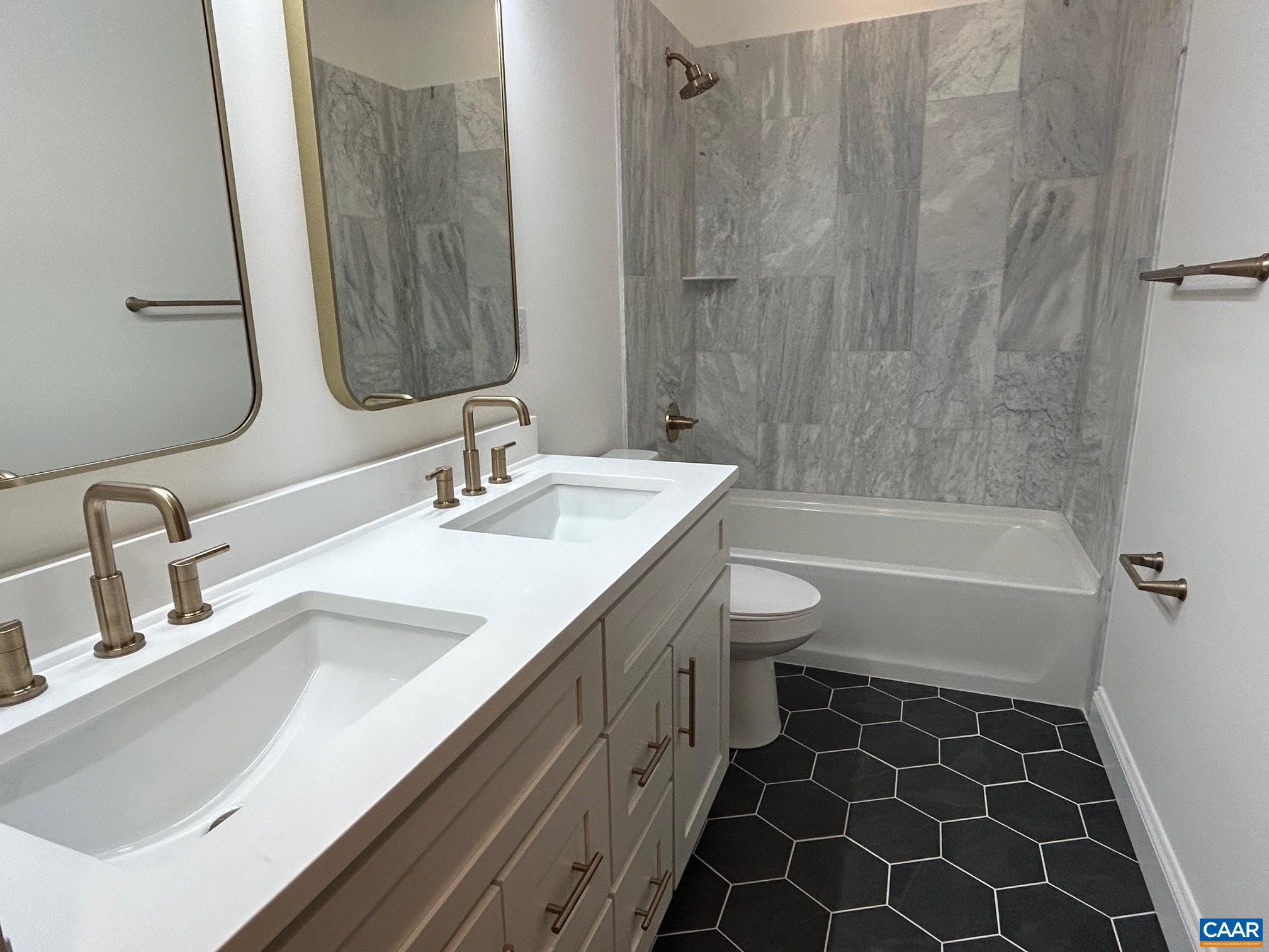 329 Carrsbrook Drive Charlottesville, VA 22901 - Photo 74 of 75 a bathroom with a double vanity sink toilet and shower